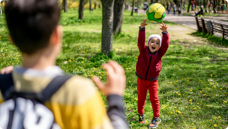 Child throwing a soccer ball